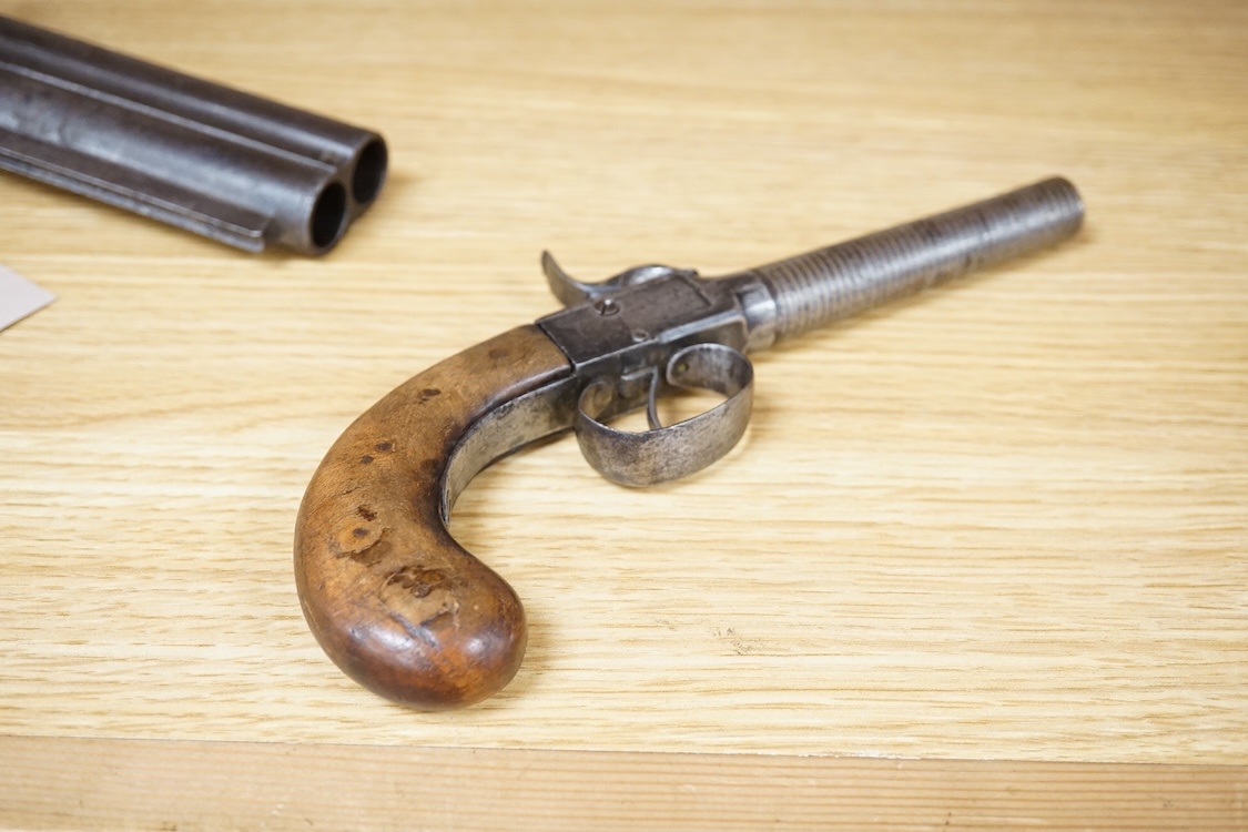 A boxlock percussion pocket pistol with turn off barrel inlaid with spiral brass wire for full length, plain frame and rounded walnut grip, probably Belgium made